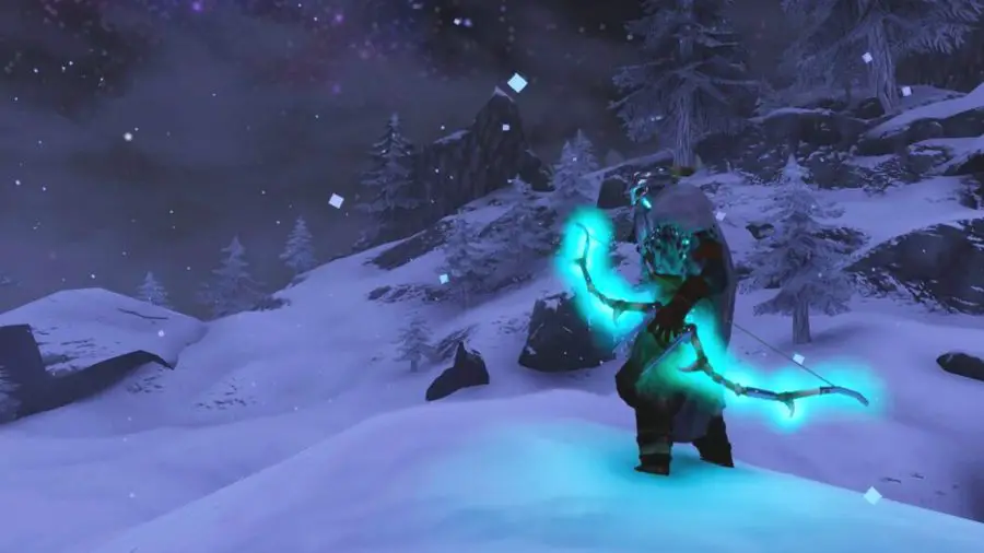 Un personaje en Valheim con un lazo azul brillante, parado en una montaña nevada.