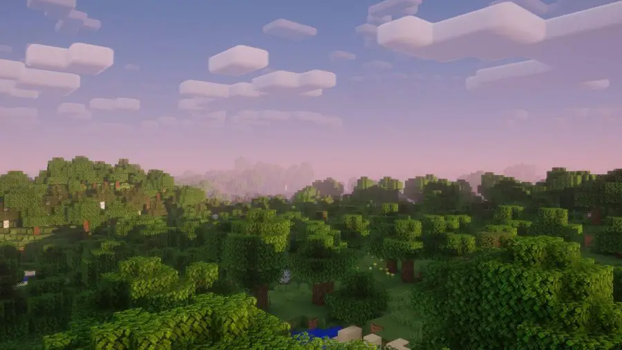 Une vue sur les toits et les arbres dans le Nostalgia Minecraft Shader pendant le coucher du soleil.