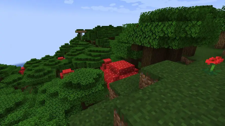 Debout au-dessus de la cime des arbres d'une forêt sombre, l'un des nombreux biomes Minecraft