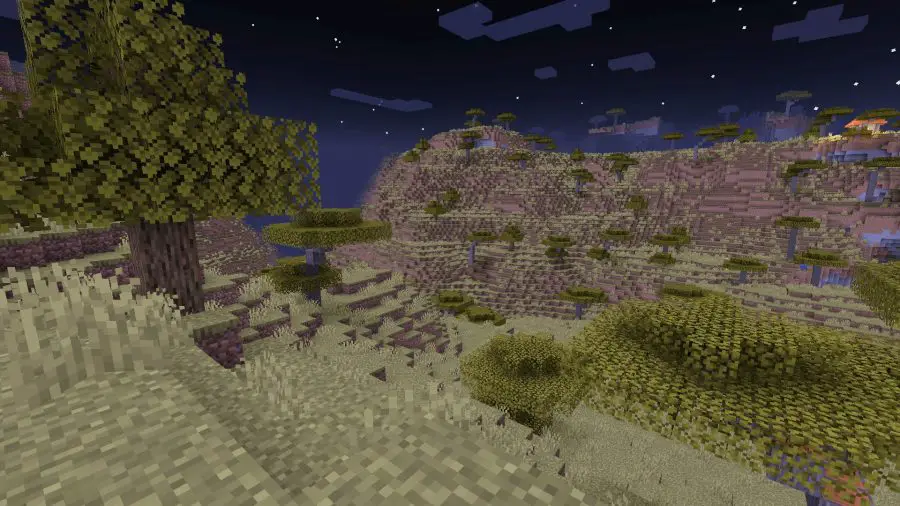 Une section de savane descendant dans une vallée, l'un des nombreux biomes de Minecraft
