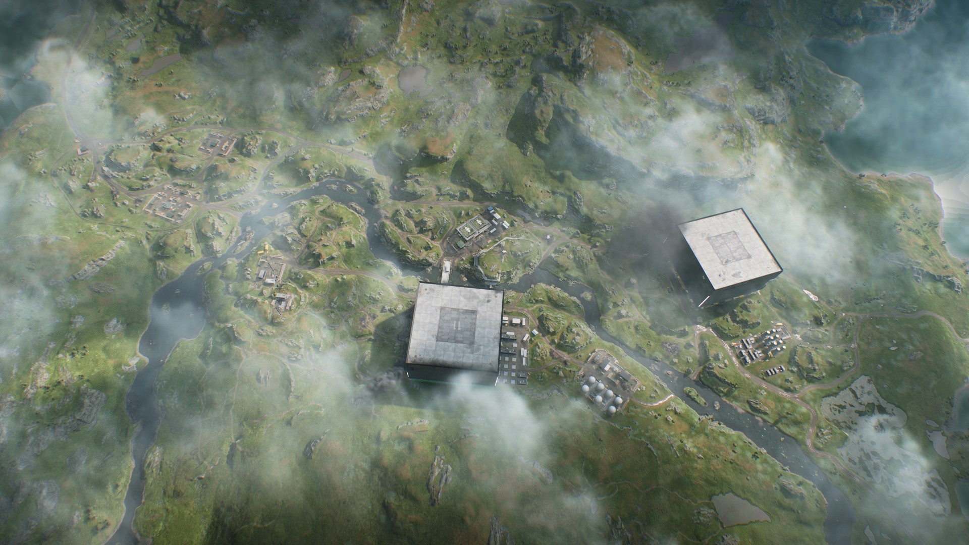 Battlefield 2042 saison 3 nouvelle carte pratique : une vue aérienne de la carte Fer de lance, avec deux grands bâtiments carrés sur les côtés opposés d'un ruisseau qui traverse la campagne rocheuse suédoise