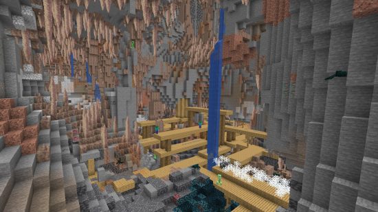 De grandes grottes de goutte à goutte Minecraft s'imbriquent avec un puits de mine et une obscurité profonde.