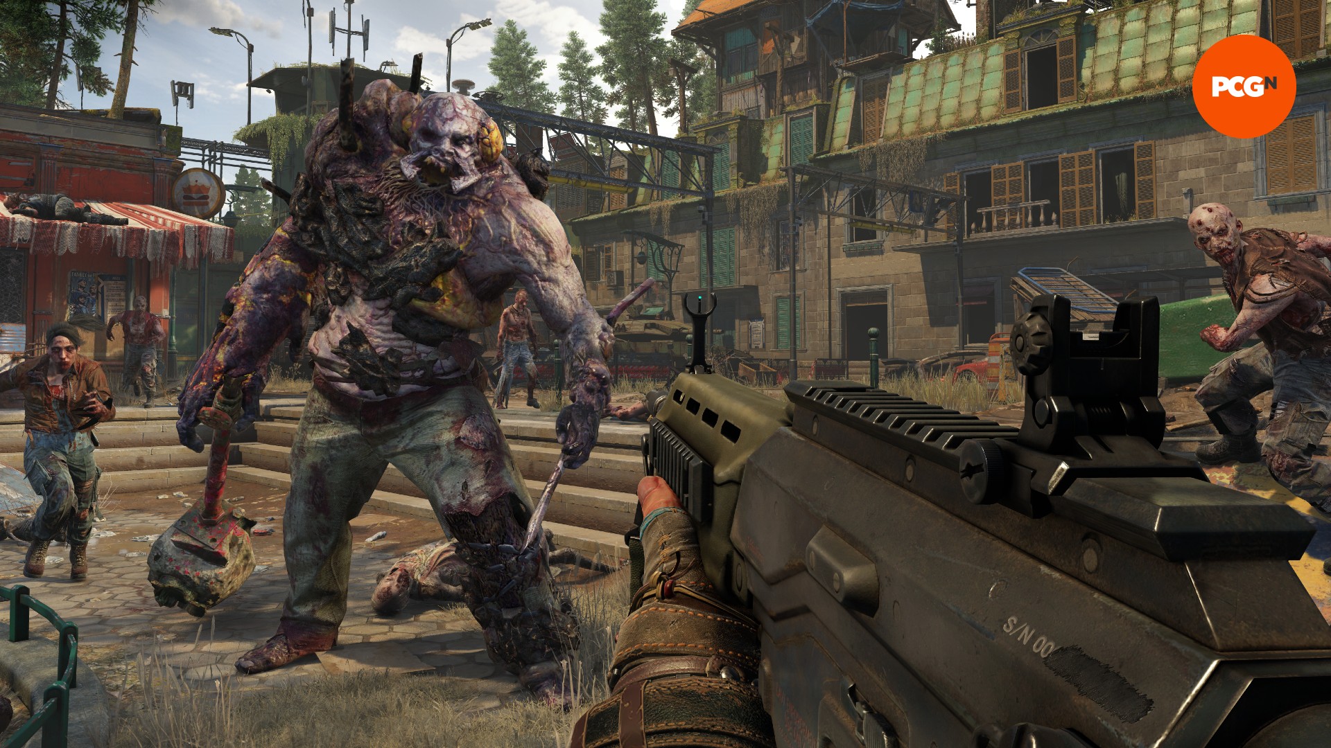Eine riesige Zombie-Kreatur geht auf einen Mann mit einer Waffe zu, flankiert von kleineren Zombies.