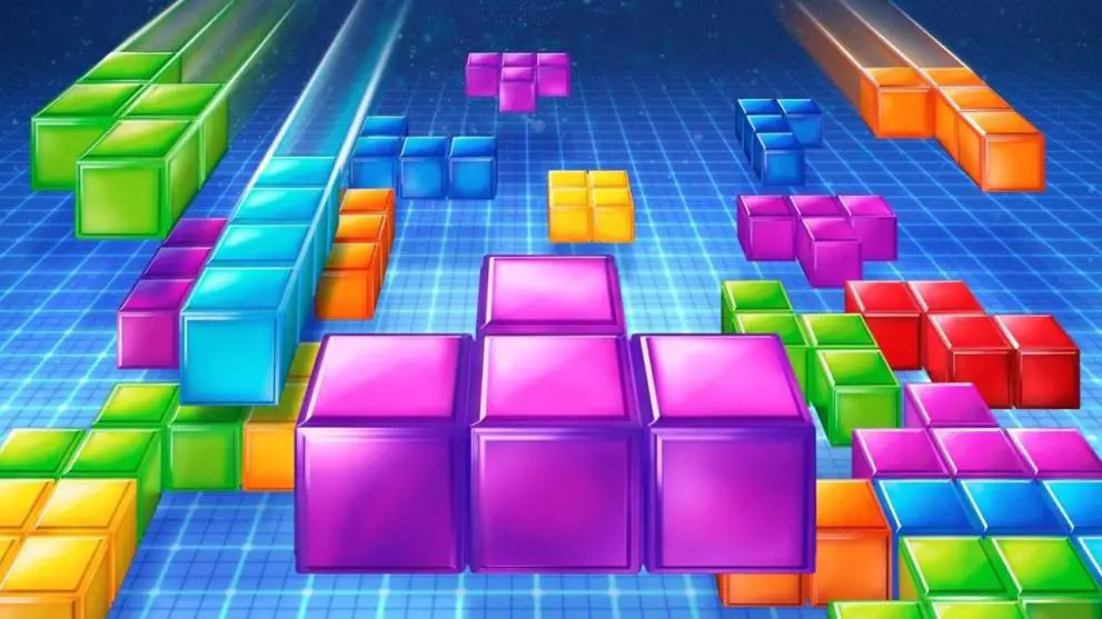 Ein Werbekunstwerk für die Tetris-Videospielserie. Es zeigt viele bunte geometrische Formen, sogenannte Tetrominos, die fallen.