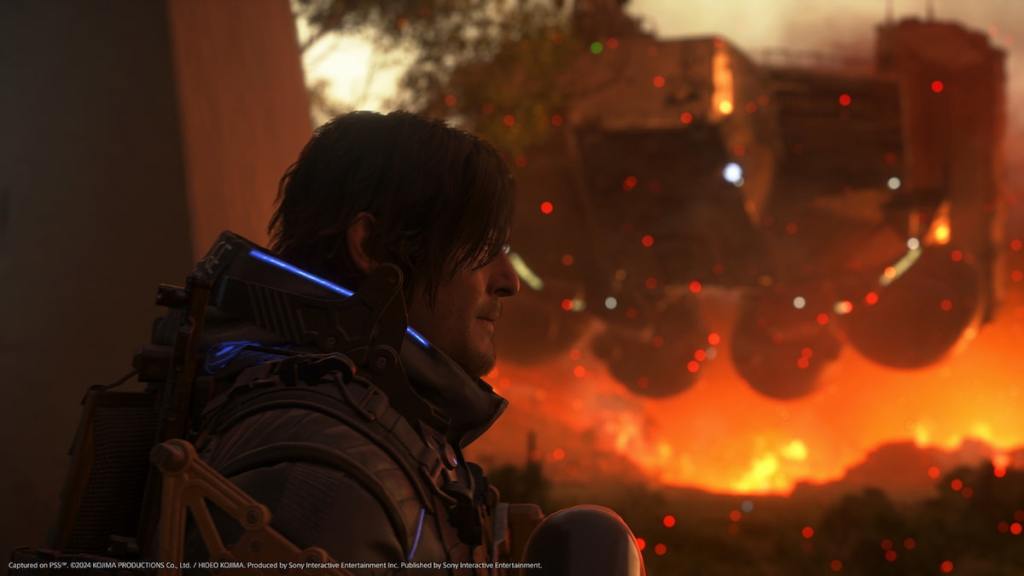 Death Stranding 2 Sam avec feu dans la capture d'écran de fond